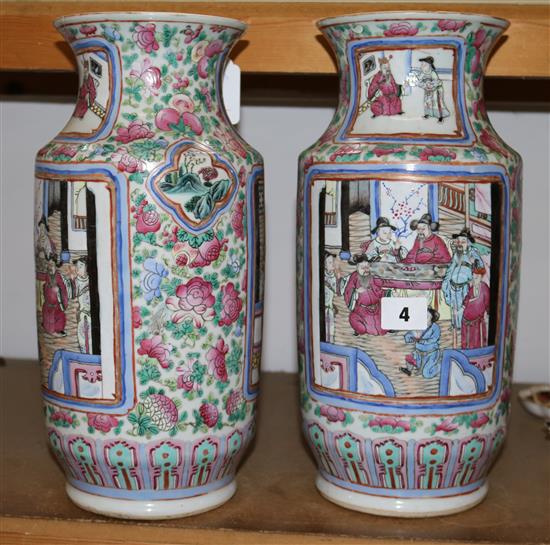 A pair of Chinese-Canton decorated famille rose cylindrical vases, mid 19th century, height 35.5cm, some damage(-)